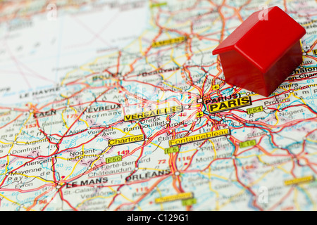 closeup map Paris with symbol of hotel. shallow DOF Stock Photo