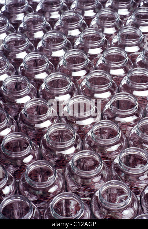 Glass bottles on the assembly line of a glass product manufacturing plant Stock Photo