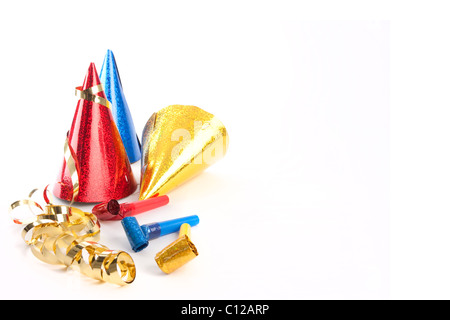 Party hats, blower and streamers isolated on white Stock Photo