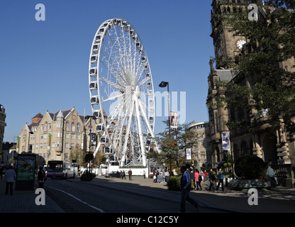 The Ferris Wheel and Town Hall from Pinstone St in Sheffield City centre England UK Stock Photo