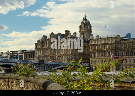 Edinburgh - Aug 8: View of Balmoral Hotel with Clock Tower and North Bridge with Butterfly Bushes (Buddleia davidii) 2007. Stock Photo