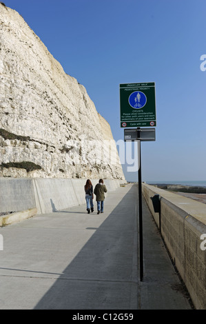 The Undercliff Walk at Ovingdean near Brighton with sign warning cyclists to look out for pedestrians Stock Photo