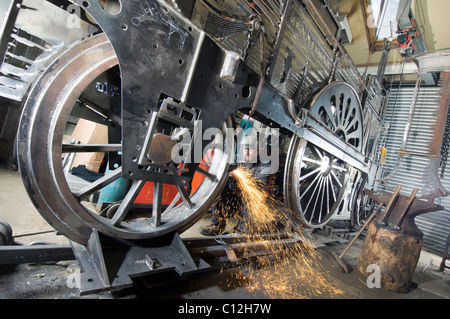 Sculptor Jon Mills welds the frame of his lifesize two-dimensional artwork based on steam train 'Jenny Lind' Stock Photo