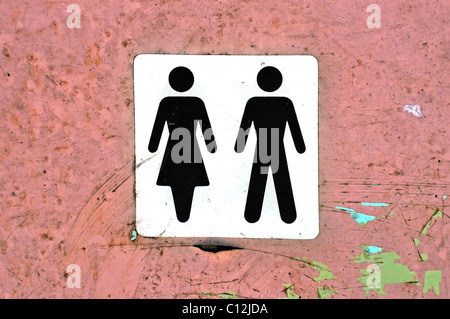 Male female symbol label on grungy wood background texture. Stock Photo