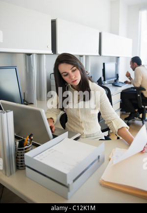 USA, New Jersey, Jersey City, business woman and man working in office Stock Photo