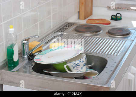 A pile of dirty dishes in the dishwasher Stock Photo