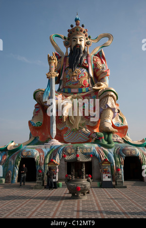 Statue of Taoist God Xuan-tian-shang-di on Lotus Lake Stock Photo