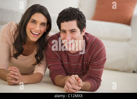 USA, New Jersey, Jersey City, portrait of couple lying on floor Stock Photo