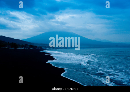The volcano, Gunung Agung, can be clearly seen from the beach in the Amed area of eastern Bali, Indonesia. Highest point in Bali Stock Photo