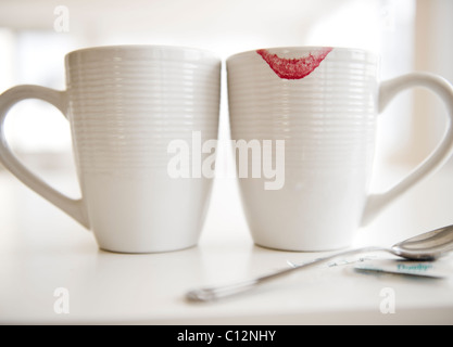 USA, New Jersey, Jersey City, close up of coffee mugs, one with red lipstick sign on edge Stock Photo