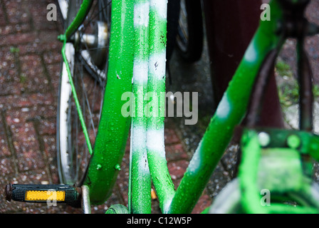 Green bicycle frame in rain, Amsterdam, Holland Stock Photo