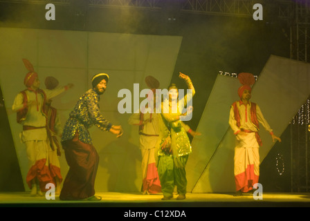 Dancers performing on stage in a wedding Stock Photo