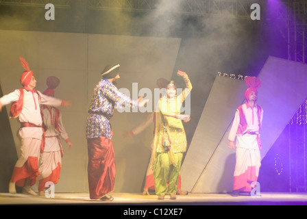 Dancers performing on stage in a wedding Stock Photo