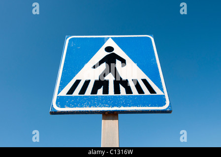 Road sign at zebra crossing warning drivers to give way to Stock Photo