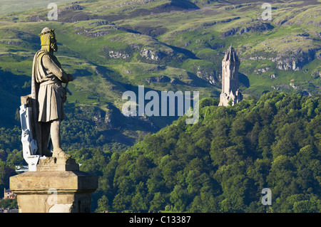 View from Stirling Castle Esplanade of The National Wallace Monument and a statue of King Robert the Bruce. Stirling, Scotland. Stock Photo