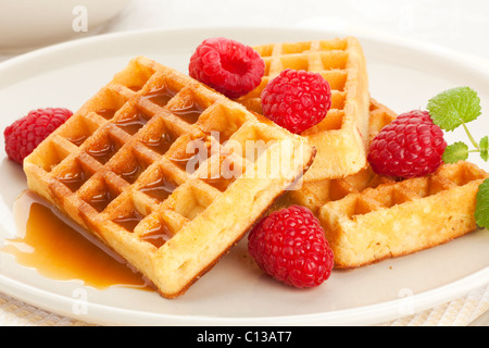 belgian waffles with raspberries and caramel sauce Stock Photo