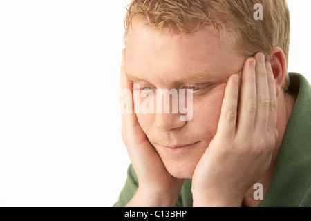 Young man deep in thought Stock Photo