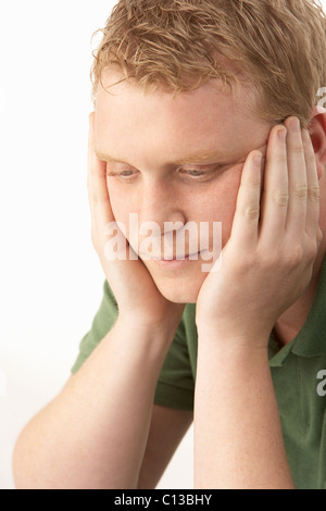 Young man deep in thought Stock Photo