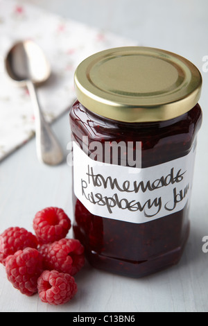 A still life of raspberry jam in jar Stock Photo