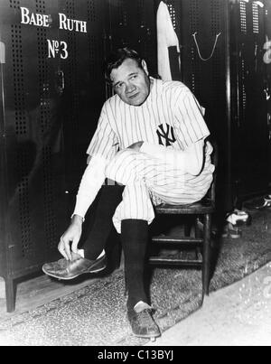 Babe Ruth in baseball uniform standing in dugout Stock Photo - Alamy