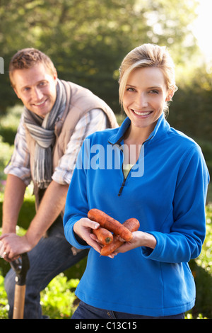 Young couple posing in garden Stock Photo