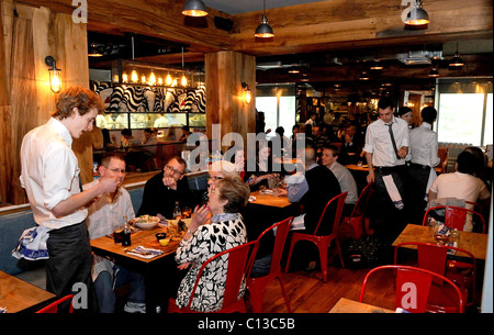 People enjoying lunch in Jamie's Italian in Brighton, one of a chain owned by celebrity chef Jamie Oliver Stock Photo