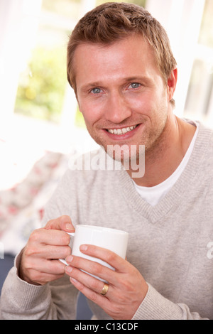 Man drinking from cup Stock Photo