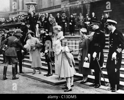 Queen Elizabeth (front, second from left), the former Duchess of York, King George VI (front, third from left), Princess Elizabeth (front, right of center), Princess Margaret (behind Princess Elizabeth), at their Coronation, England, May 12, 1937. Stock Photo