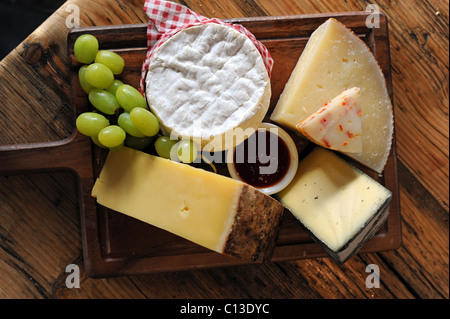 A selection of delicious cheeses for sale in Artisan Delicatessen restaurant Stock Photo