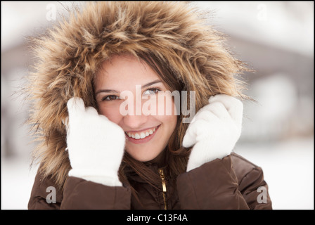USA, Utah, Lehi, Portrait of young woman wearing fur hooded coat Stock Photo