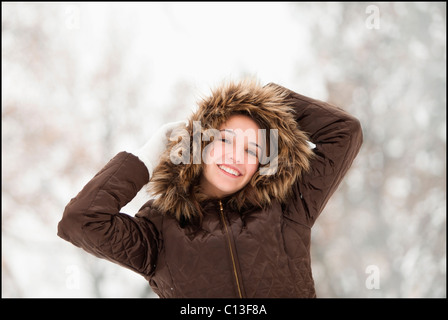 USA, Utah, Lehi, Portrait of young woman wearing winter coat outdoors Stock Photo