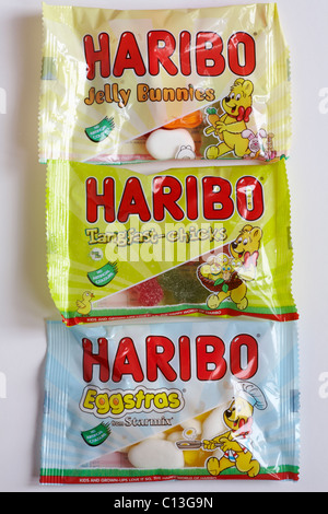 Packets of Haribo Easter sweets - Jelly Bunnies, Tangfast-chicks and Eggstras sweets for Easter on white background Stock Photo