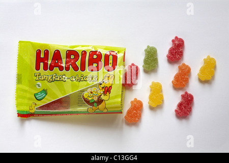 Packet of Haribo Tangfast-chicks sweets for Easter with contents spilled isolated on white background Stock Photo