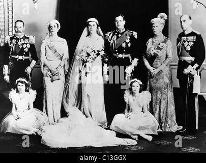 British Royal Family. Seated, from left: Future Queen of England Princess Elizabeth, Lady Mary Cambridge. Standing, from left: King George V of England, Grand Duchess Elena of Russia, Princess Marina, Duchess of Kent, Prince George, Duke of Kent, Queen Mary of Teck, Prince Nicholas of Greece and Denmark, London, England, November 29, 1934. Stock Photo
