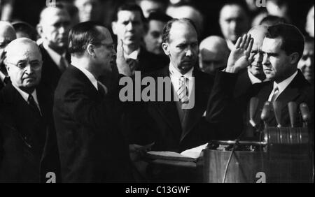 Richard Nixon first Vice Presidential Inauguration. Future US President Richard Nixon being sworn in as Vice President of the United States by California Senator William Knowland. From left: outgoing US President Harry Truman, Knowland, Secretary of State Mark Trice (holding the Bible), Nixon, Washington D.C., January 20, 1953. Stock Photo