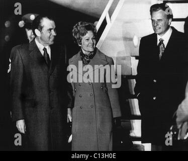 1972 US Presidency. From left: President Richard Nixon sees off First Lady Patricia Nixon and Christian evangelist Billy Graham as they fly to the inauguration of Liberian President William R. Tolbert Jr, 1972. Stock Photo