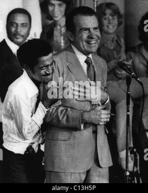 Nixon Presidency. Sammy Davis Jr. embraces US President Richard Nixon at a youth rally during the US Presidential campaign, 1972. Stock Photo