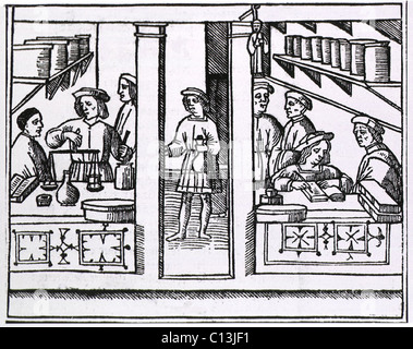 Pharmacy scene from the title page of a Latin version of Galen's RECETARIO DE GALIENO, published in Venice in 1518. Stock Photo
