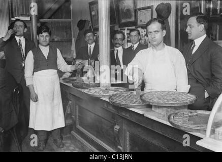 Rich pastries on display in a Lebanese-Syrian restaurant in New York City. Many immigrants opened small businesses, including restaurants in their ethnic communities. Ca. 1910. Stock Photo