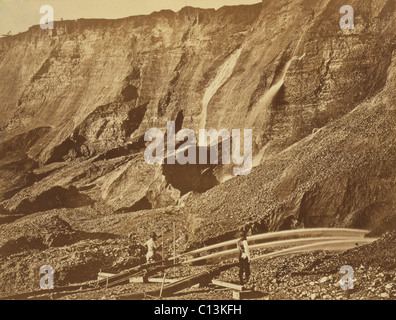 Hydraulic gold mining near Dutch Flat, California. Hydraulickers used jets of water to wash gold from mountains. 1868 photo by Andrew J. Russell Stock Photo