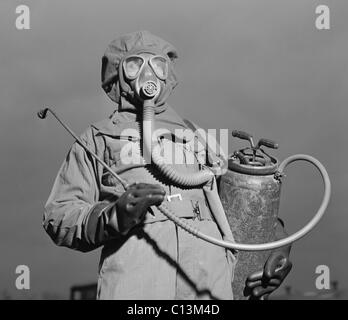 World War II era American soldier in a decontamination suit . December 1942. Stock Photo