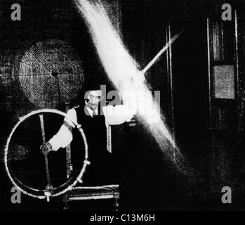 Nikola Tesla 1856-1943 conducted spectacular demonstrations of electricity. This image published in ELECTRICAL REVIEW in 1899 was accompanied by with this caption The operator's body in this experiment is charged to a high potential by means of a coil responsive to the waves transmitted to it from a distant oscillator.