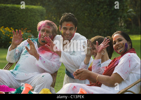 Family celebrating Holi Stock Photo