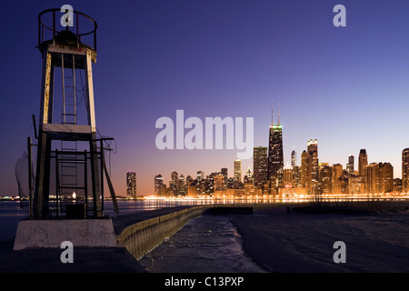 USA, Illinois, Chicago, City skyline from Lake Michigan at sunset Stock Photo