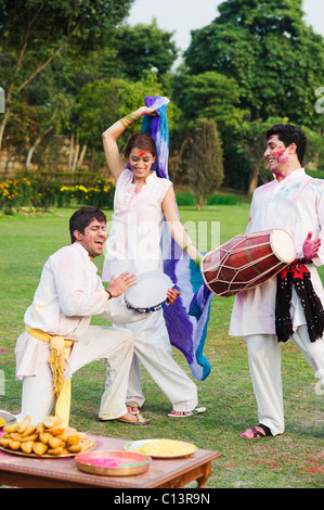 Friends celebrating Holi Stock Photo