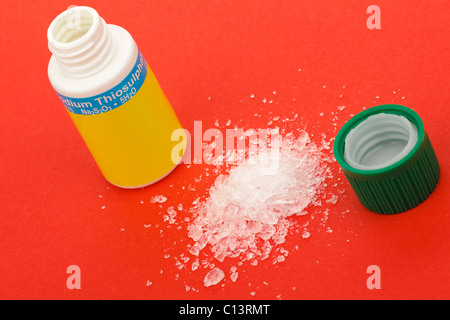 Opened plastic container of Sodium Thiosulphate Stock Photo