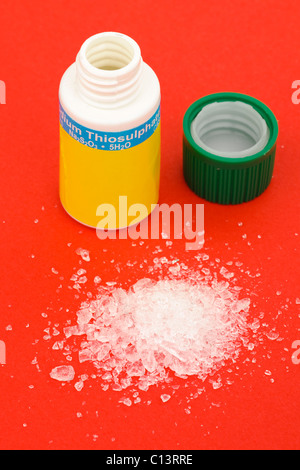 Opened plastic container of Sodium Thiosulphate Stock Photo