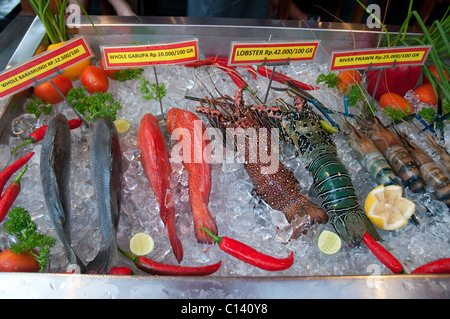 Display of fresh fish on ice outside a restaurant in Ubud, Bali, Indonesia Stock Photo