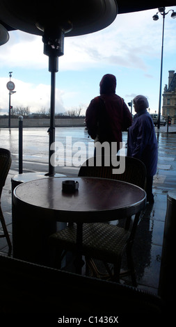 French cafe windy day Paris tables silhouettes Stock Photo - Alamy