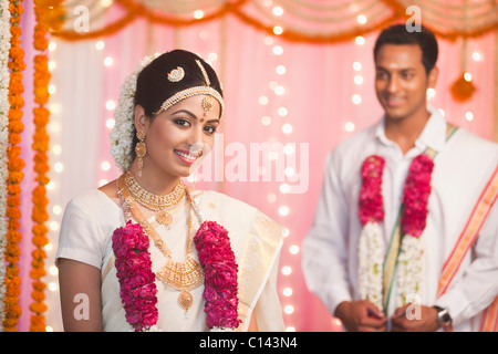 Portrait of a bride wearing varmala and smiling Stock Photo